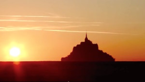 Mont Saint-Michel from motorcycle in sunset