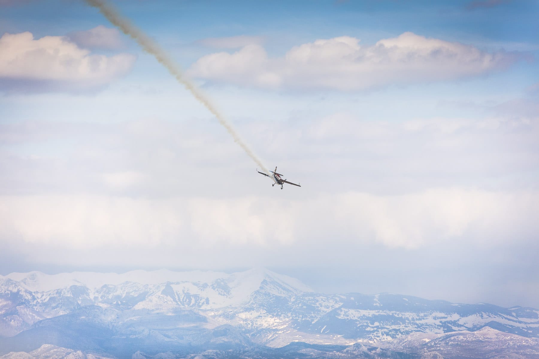 Aerobatic airplane with snow
